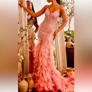 Coral mermaid style prom dress with feathers